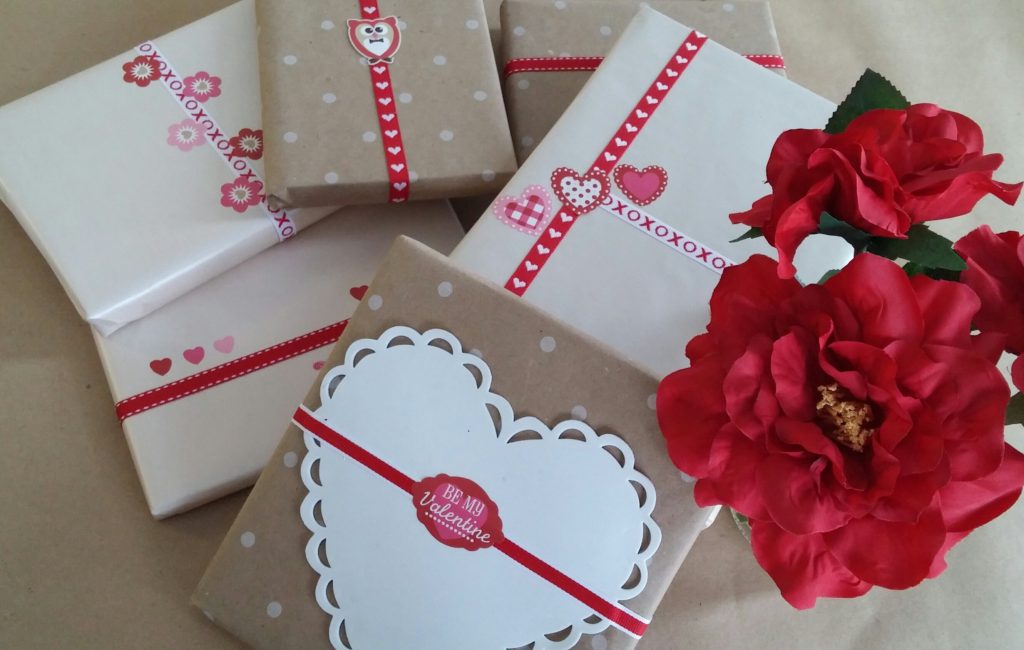 Books wrapped in brown paper with Valentine's decorations