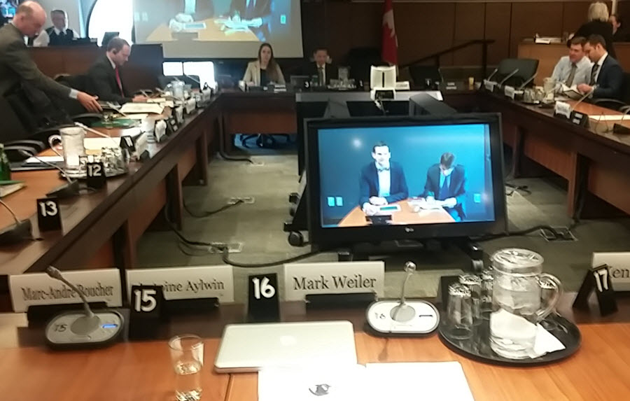 Table with name cards for the House of Commons Standing Committee on Access to Information, Privacy, and Ethics