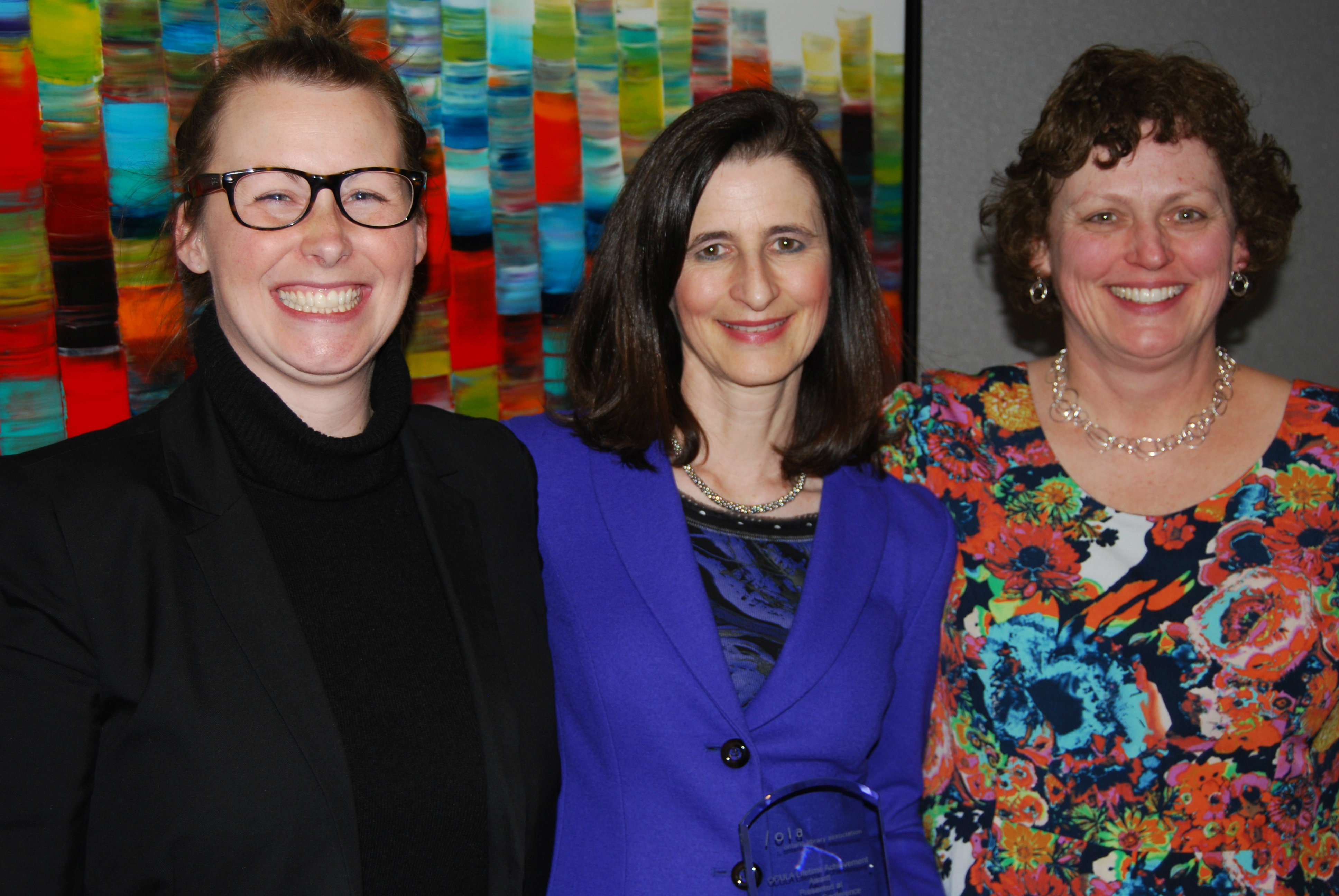 Mary Ann Mavrinac (centre), OCULA's 2014 Lifetime Achievement Award winner, along with nominators Kim Stymest (left) and Lorna E. Rourke (right) at the 2014 OCULA AGM.