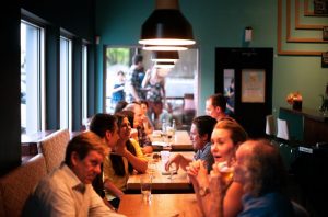 People in a restaurant eating and talking