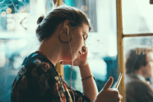 Woman listening to something on her mobile device